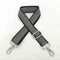 Detail of black and white herringbone nylon bag strap with silver metal hooks and buckles - Silver Stripe Silver Buckle