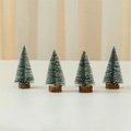 Σετ 4 μίνι χριστουγεννιάτικα δέντρα 10cm με εφέ χιονιού και ξύλινες στρογγυλές βάσεις - Πράσινο (Σετ των 4)