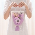 Purple soap rose bouquet with LED lights in a transparent PVC gift bag held by hands - 3-Flower Box [Purple Gradient Rose + Sunflower] + Light + Card