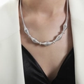 Silver twisted chain necklace with segmented metal design worn by model on neck - Multi-segment Coil Design / Steel Color (P1775)