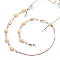 Bohemian gold glasses chain with white sea shells and round pearls on white background - Gold