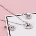 Stainless steel jewelry set featuring interlocking heart necklace and stud earrings with zircons - Steel Color (KS116119-KSP)