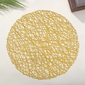 Close-up of a circular gold PVC cutout placemat with a shiny metallic woven texture - 38cm Round / Gold Yellow