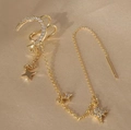 Earcuff dorado de estrella y luna con borlas y cristales blancos sobre fondo de seda - Pieza Única / Oro Claro