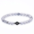 White turquoise bead bracelet with letter T charm and metal spacers on elastic cord - Letter T Bracelet