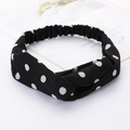 Black fabric twisted headband featuring white polka dots on a minimalist white setting - Small Dots Black