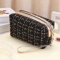 Rechteckige schwarz-goldene Tweed-Kosmetiktasche mit goldenem Reißverschluss - Schwarz