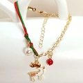 Close-up of Christmas bracelet with white reindeer charm, red beads and gold chain detail - Elk Style (HLBX2025-鹿)