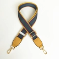 Detail view of adjustable purple and green striped bag strap with yellow leather ends - Yellow + Yellow Leather