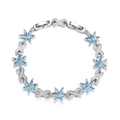 Elegant silver bracelet featuring light blue gemstone flowers and sparkling zircon accents - Lake Blue