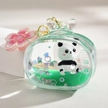 Dettaglio portachiavi panda con liquido verde, paillettes e ciondolo a ciliegio - Forma TV e Ciondolo Sakura / Verde