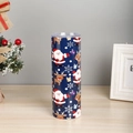 Detailed view of 20oz Christmas tumbler with Santa Claus patterns on a wooden surface - Dark Blue Cartoon Christmas