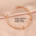 Detalle del brazalete abierto de acero inoxidable oro rosa 60,5 mm con abalorios - Oro rosa