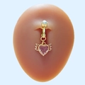 Golden heart-shaped navel clip with pink stone and angel wings on a silicone model - Pink Heart Wings Style (#7)