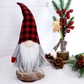 Christmas gnome doll with plaid hat on a wooden base with pine cones and berries - Black and Red Plaid