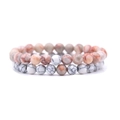 Close-up of 8mm beaded stretch bracelets featuring natural agate and white turquoise stones - Red Vein Stone + White Vein Turquoise
