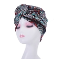 Front view of turban hat with geometric ethnic pattern on white mannequin head - Style 1-Multicolor Geometric Ethnic