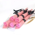 Detail of pink artificial soap carnations with decorative black ribbons on white desk - Pink (Shiny Carnation)