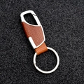 Detail of brown leather car keychain with polished silver metal spring buckle on black background - Brown Spring Clip Style (GD-345)