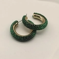 Close-up of gold-plated C-shape hoop earrings with micro-pave green rhinestones - Green