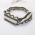 Criss-cross fabric headband featuring black, white and yellow geometric patterns - Style 82 Black Geometric