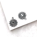 Close-up of silver-tone Eye of Horus charms with sunburst design for DIY jewelry - Eye (14x17mm)