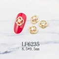 Macro detail of gold flower nail charms with pearls and iridescent stones, size 8.5x9.5mm - Gold Petal Pearl Aurora Rhinestone Style (6235)
