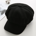 Top-down view of a vintage black wool baker boy hat with classic paneled crown detail - M / Black