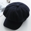 Top view of navy wool octagonal baker boy hat showing stitched panels and top button - M / Navy Blue