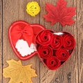 Macro shot of 6 soap roses in a heart-shaped tin box with a romantic greeting card - Solid Red (6 Flowers Heart)
