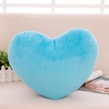 Soft blue heart-shaped plush pillow on a beige sofa in a cozy home setting - Sky Blue