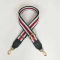 Adjustable woven shoulder strap with red, green, and white stripes and gold buckles - Gunmetal Hardware / Green + Green Leather