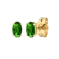 Macro shot of oval cut green emerald earrings with gold four-prong setting - Gold Oval Cut Green Zircon
