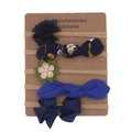 Detailed close-up of 5-piece baby headband set with fabric flowers and bows on display card - Royal Blue Series Style