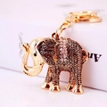 Portachiavi a forma di elefante dorato con strass lucidi e dettagli in metallo intagliato - 10.7x5.4CM / Oro