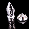 Macro shot of silver-tone fountain pen nib brooch with polished finish and butterfly clutch - Silver Pen Nib