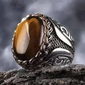 Macro shot of men's vintage copper ring with oval tiger eye stone on black rock - Oxidized Brown Tiger Eye(KJZ032XS)