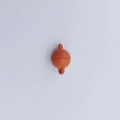 Macro detail of reddish-brown matte heart magnetic clasps for DIY jewelry making - Sphere / Orange
