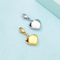 Detailed view of heart-shaped gold and silver stainless steel pendants with lobster clasps - Heart 2 / Steel