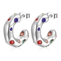 Macro view of C-shaped stainless steel earrings with colorful inlaid rhinestones - Silver/Multicolor Zirconia