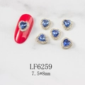 Macro detail of 3D heart-shaped blue nail art crystals with gold metal base 7.5x8mm - Light Blue Heart Gold Base (6259)