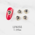 Macro detail of heart nail charm LF6255 with grey stone and gold frame on nails - Grey Heart Gold Base (6255)