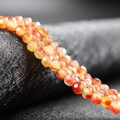 Strand of 4mm faceted orange-red agate beads with natural stone texture for DIY jewelry - Red Flower