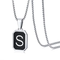 Macro shot of silver stainless steel box chain with black square pendant letter S - Letter S