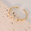 Minimalist gold open bracelet featuring six white freshwater pearls on a stone base - Gold Branch Pearl Style