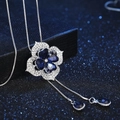 Elegant silver long sweater necklace with clover shaped blue gemstone and white crystals - Blue/Silver
