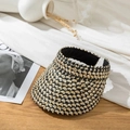 Detail of the woven black and beige straw sun visor with vintage checkered pattern - M (56-58cm) / Black