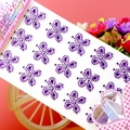 Detail of purple clover acrylic crystal gem stickers on pink background for DIY decoration - Butterfly Purple