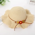 Kids straw beach hat with wavy brim, colorful fabric flowers and ribbon accent - Hat / Beige