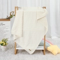 Soft cream-white knitted baby blanket with classic diamond texture hanging on wood rack - 100*80 / Off White